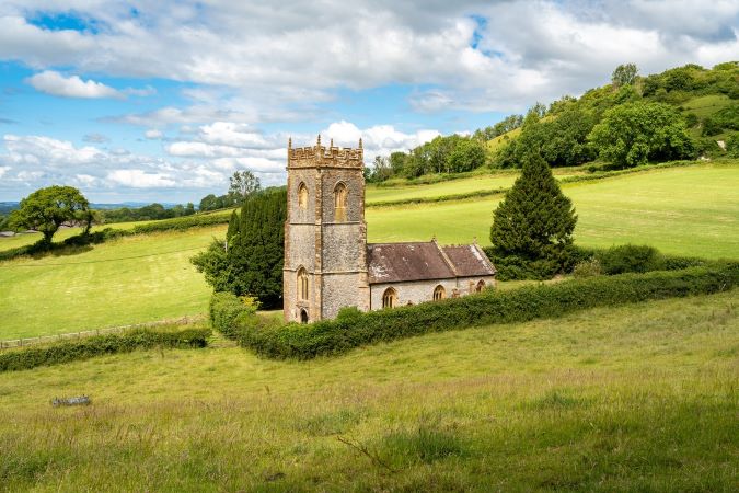 rural scene with fields and church